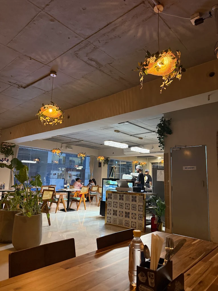 Kami cafe interior with wooden tables